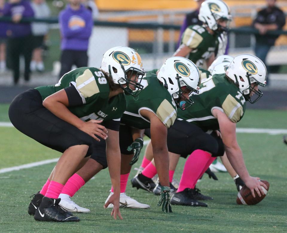 The GlenOak offensive line, including Ashton Rulewicz (59) prepares for a play against Jackson during a high school football game at Bob Commings Field on Friday, Oct. 1, 2021.