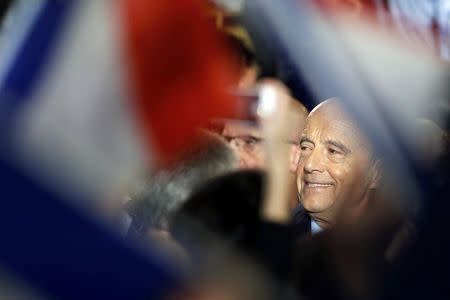 French politician Alain Juppe, current mayor of Bordeaux, a member of the conservative Les Republicains political party and candidate for the centre-right presidential primary, arrives to attend a political rally as he campaigns in Bordeaux, France, November 9, 2016. Picture taken November 9, 2016. REUTERS/Regis Duvignau