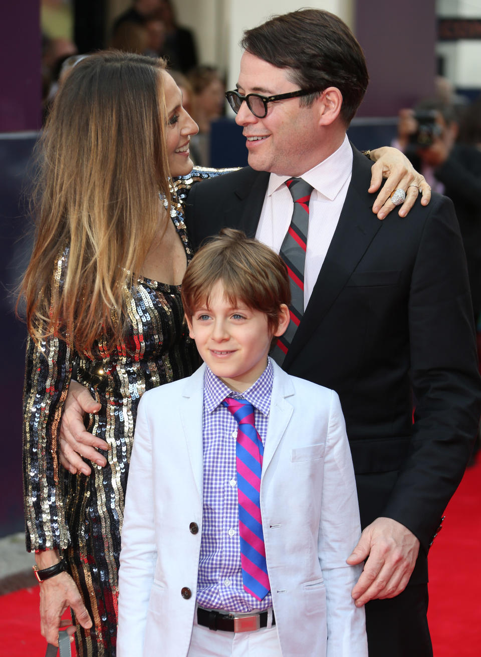 Sarah Jessica Parker, husband Matthew Broderick and their son James, arrive for the opening night of Charlie and the Chocolate Factory, a new stage musical based on Roald Dahl's popular story about Willy Wonka and his amazing Chocolate Factory, at the Drury Lane Theatre in central London, Tuesday, June 25, 2013. (Photo by Joel Ryan/Invision/AP)