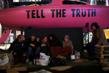 Climate change activists demonstrate during a Extinction Rebellion protest at Oxford Circus in London, Britain April 16, 2019. REUTERS/Hannah McKay