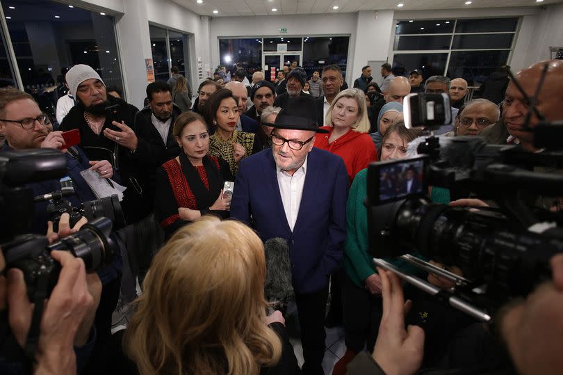 George Galloway hosting a victory party at Rochdale Suzuki Showroom following his Rochdale by-election success