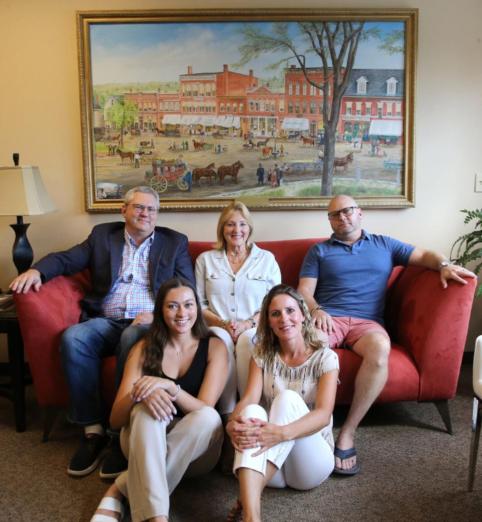Florence Ruffner, center, started her real estate business in Exeter 42 years ago and now there are three generations of Ruffners on staff. From left are Lewis Ruffner and his daughter Liz, Florence, Mollie and Scott Ruffner.