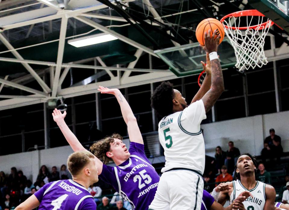 Jacksonville University forward Bryce Workman (5) lays up two of his 10 points on Thursday at Swisher Gym in the Dolphins' 59-55 victory over Central Arkansas. Workman played his first game since Dec. 6.