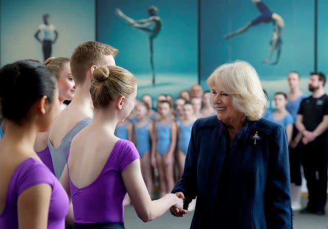 <p>WPA Pool/Getty</p> Queen Camilla meets students at Elmhurst Ballet School in March 2023