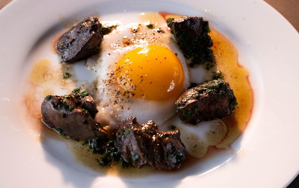 Fried duck eggs with devilled livers