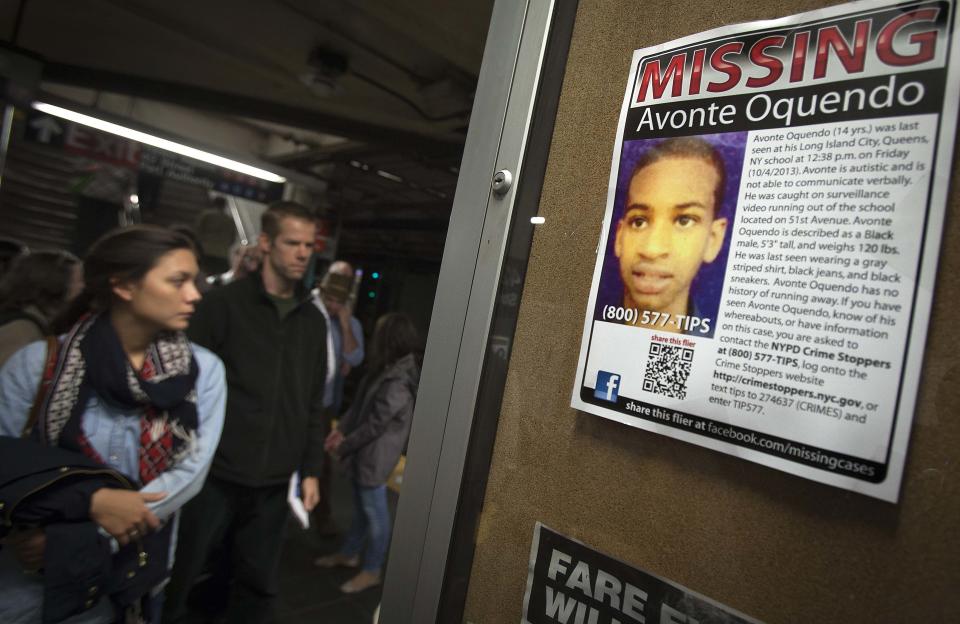 Poster for Avonte Oquendo, a missing 14-year-old autistic child, is seen in the Times Square subway stop in New York