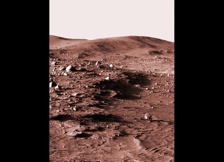 This low-Sun panorama was shot from the Spirit Pancam, looking towards Husband Hill in the late afternoon of mission sol 813 (April 16, 2006). It seemed cooler to display the image in old-school sepia tones rather than plain old black-and-white.    <em>From "Postcards from Mars" by Jim Bell; Photo credit: NASA/JPL/Cornell University</em>  