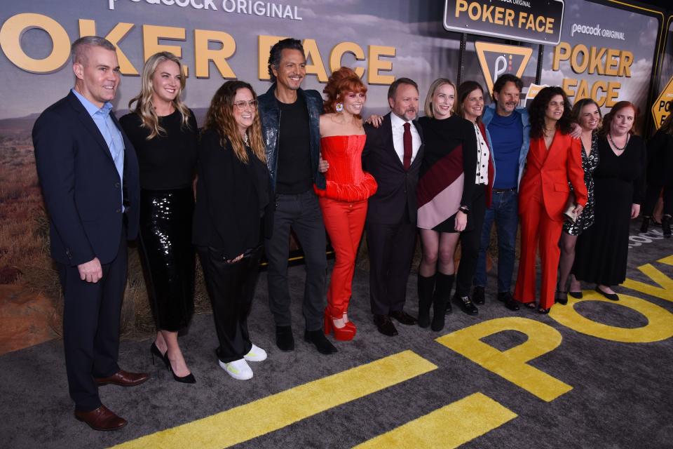 The cast and crew of "Poker Face" line up for a photo at the series' premiere