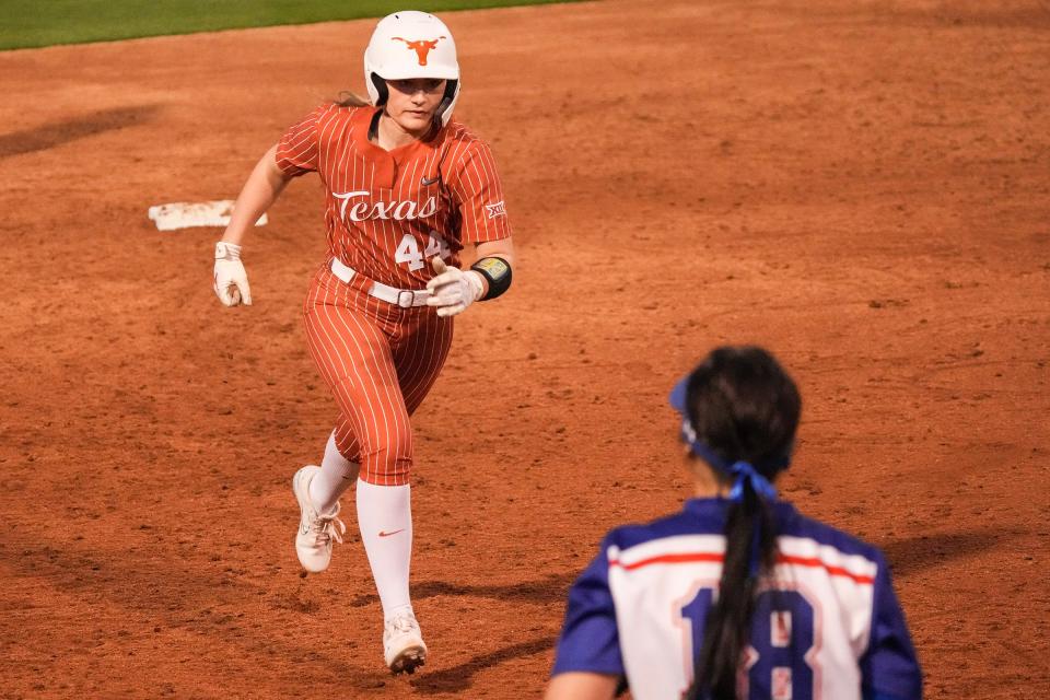 Texas outfielder Adayah Wallace (4) runs to third base as the Longhorns play Houston Christian at McCombs Field on Wednesday, Feb. 21, 2024.