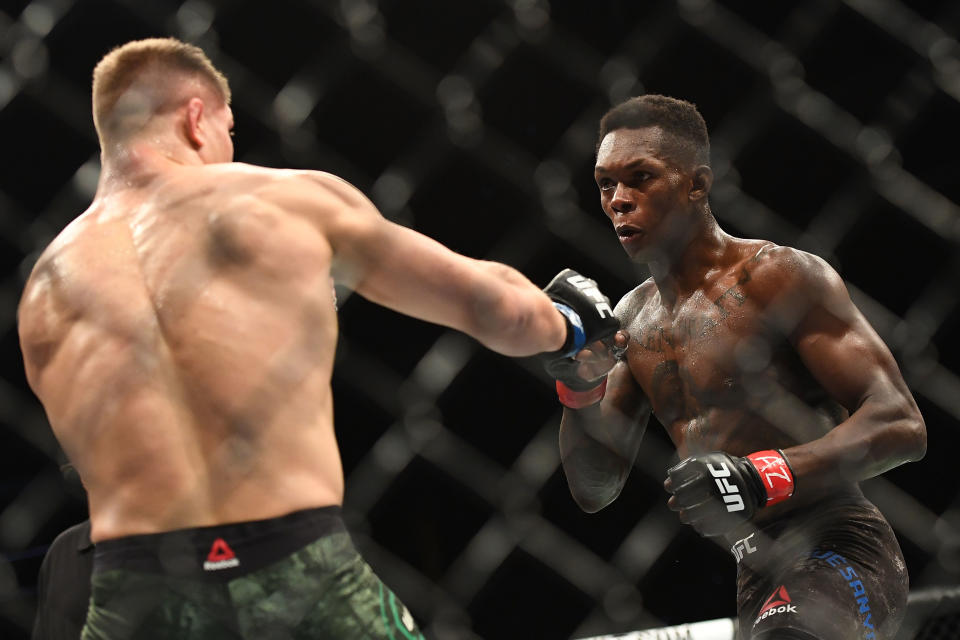 GLENDALE, AZ - APRIL 14: (R-L) Israel Adesanya of Nigeria in action during the middleweight fight against Marvin Vettori of Italy during the UFC Fight Night at Gila River Arena on April 14, 2018 in Glendale, Arizona.  (Photo by Jennifer Stewart/Getty Images)