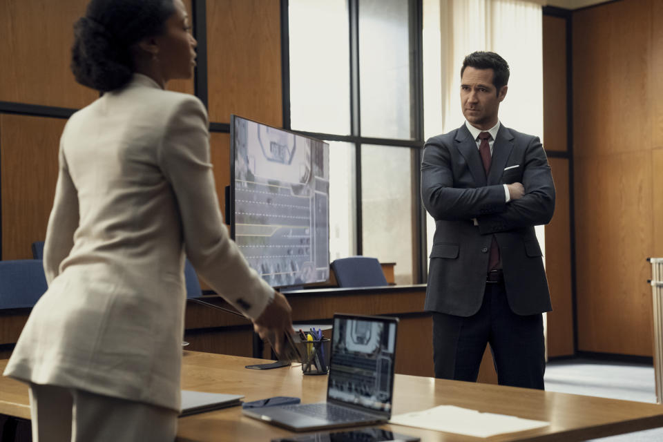 This image released by Netflix shows Yaya DaCosta, left, and Manuel Garcia-Rulfo in a scene from "The Lincoln Lawyer." (Lara Solanki/Netflix via AP)