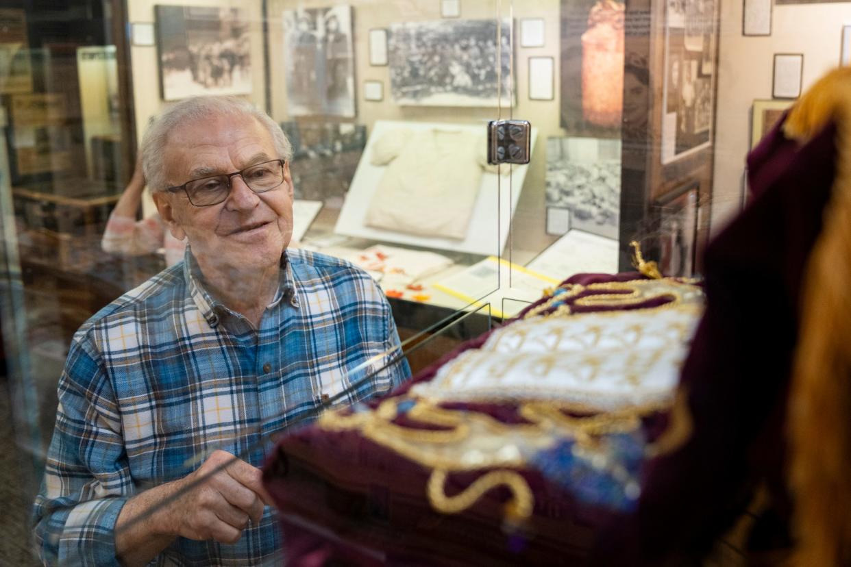 Holocaust survivor Fred Kurz admires the Distenfeld-Glick Torah scroll on display in the Esther Raab Holocaust Museum at the Jewish Community Center in Cherry Hill, N.J.