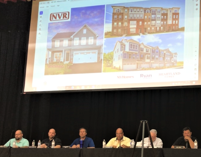 The Woolwich Township Joint Land Use Board held a six-hour meeting starting Thursday night on the Kings Meadow residential project, which will build 1,065 houses of different types off Kings Highway and Asbury Station Road. The board approved the project's subdivision and site plan proposals on an 8-to-1 vote. The project was crafted with township input, including addressing a need for affordable housing. The hearing was held at Kingsway Middle School to accommodate an expected crowd. Left-right: Members Jon Fein, Joseph Morgan III, Mayor Craig Frederick; Chairman Joe Maugeri; Solicitor Mike Aimino; and member John Juliano. PHOTO: August 17, 2023.