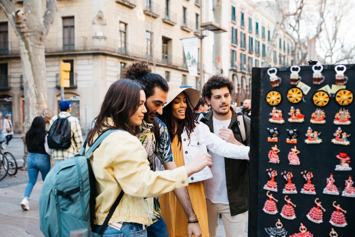 Tourists looking at souvenirs in Barcelona