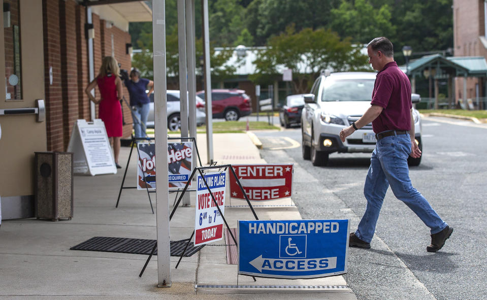 Voters enter the Courthouse Community Center to cast their ballots in the Republican primary in Stafford County, Va., on Tuesday, June 21, 2022. (Peter Cihelka/The Free Lance-Star via AP)