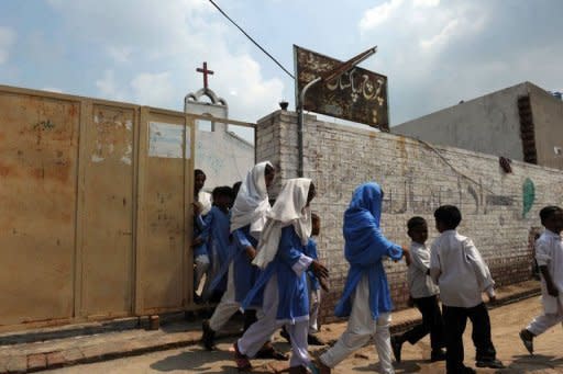 Pakistani Christian children exit a church after religious classes in their village in Korian on August 30, 2012. A Pakistani cleric who submitted evidence against a Christian girl accused of blasphemy has been arrested on suspicion of evidence-tampering and desecrating the Koran, police said