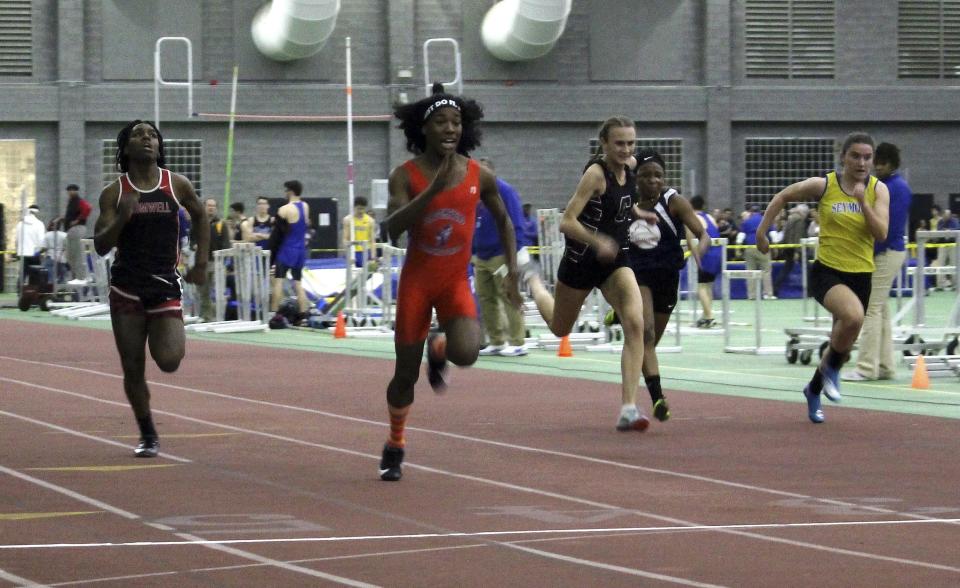 FILE - In this Feb. 7, 2019, file photo, Bloomfield High School transgender athlete Terry Miller, second from left, wins the final of the 55-meter dash over transgender athlete Andraya Yearwood, far left, and other runners in the Connecticut girls Class S indoor track meet at Hillhouse High School in New Haven, Conn. Miller and Yearwood are among Connecticut transgender athletes who would be blocked from participating in girls sports under a federal lawsuit filed Wednesday, Feb. 12, 2020, by the families of three athletes. (AP Photo/Pat Eaton-Robb, File)