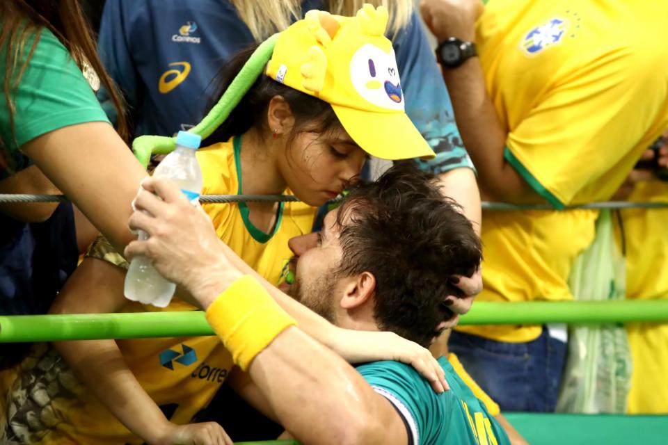 <p>Diogo Kent Hubner of Brazil kisses his daughter Clara during the Mens Preliminary Group B match between Poland and Brazil at the Future Arena on Day 2 of the Rio 2016 Olympic Games at the Future Arena on August 7, 2016 in Rio de Janeiro, Brazil. (Photo by Phil Walter/Getty Images) </p>