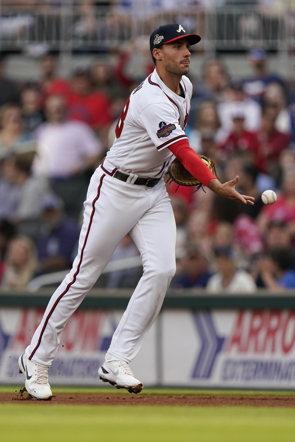 Atlanta Braves first baseman Matt Olson (28) tosses the ball to first for the out after fielding a ground ball by Oakland Athletics' Tony Kemp during the first inning of a baseball game Wednesday, June 8, 2022, in Atlanta. (AP Photo/John Bazemore)