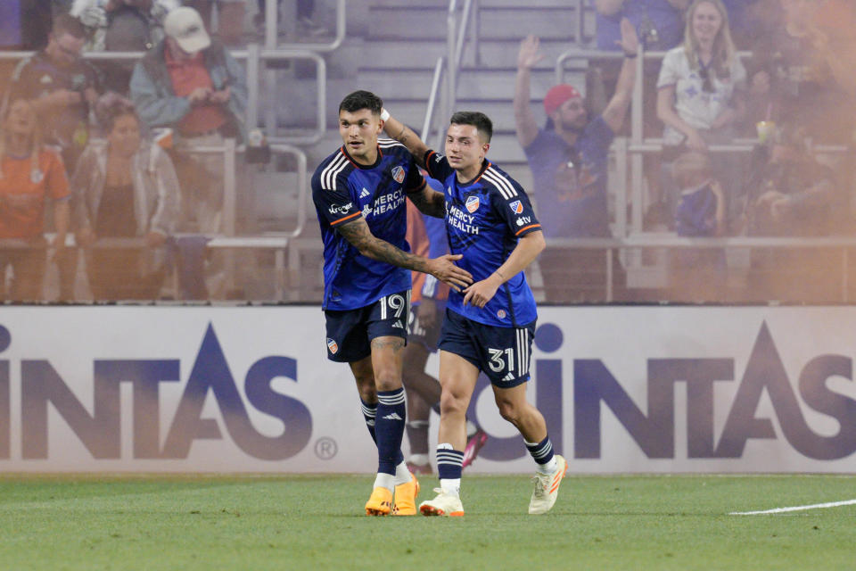 FC Cincinnati's Brandon Vázquez (19) celebrates with Álvaro Barreal (31) after scoring a goal during the second half of an MLS soccer match against CF Montreal Wednesday, May 17, 2023, in Cincinnati. (AP Photo/Jeff Dean)