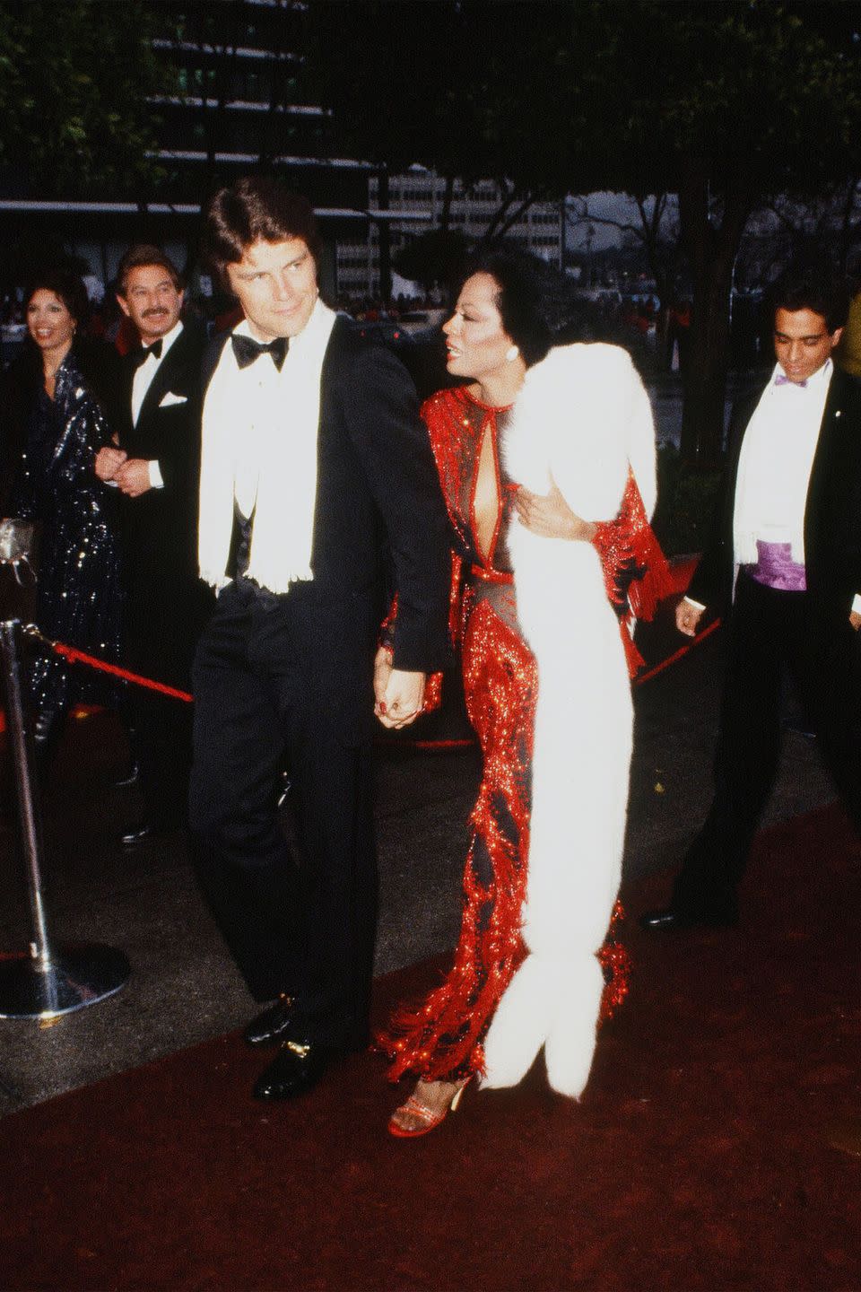 <p>No one could match Diana Ross's level of glamour girl. The diva rocked a crimson red sequin gown, with a white fur stole to the '82 ceremony.</p>