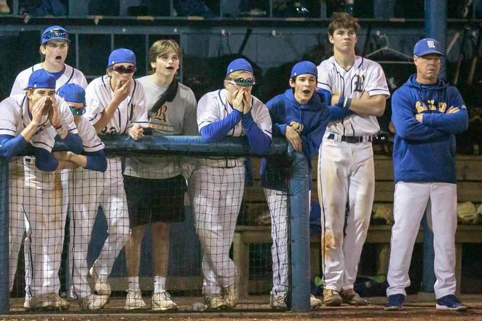 Resurrection coach Johnny Olsen watches the game along side his players in the dugout during a game against Bayside Academy at MCC Park in Pascagoula on Thursday, March 10, 2022.