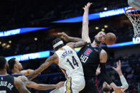 Los Angeles Clippers center Ivica Zubac (40) tries to block a pass by New Orleans Pelicans forward Brandon Ingram (14) in the first half of an NBA basketball game in New Orleans, Thursday, Jan. 13, 2022. (AP Photo/Gerald Herbert)