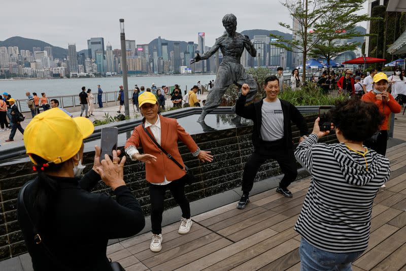 The Wider Image: Fifty years on, Bruce Lee's legacy squares up to modern life in Hong Kong