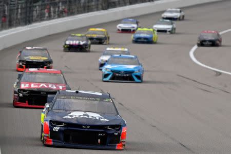 May 11, 2019; Kansas City, KS, USA; NASCAR Cup Series driver Alex Bowman (88) leads a pack of cars during the Digital Ally 400 at Kansas Speedway. Mandatory Credit: Jasen Vinlove-USA TODAY Sports