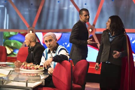 An actor playing Israel's Prime Minister Benjamin Netanyahu (2nd L) sits on the set of Eretz Nehederet ("Wonderful Country") during a taping of the television satire in a studio in Herzliya, near Tel Aviv, January 26, 2015. REUTERS/Nir Elias