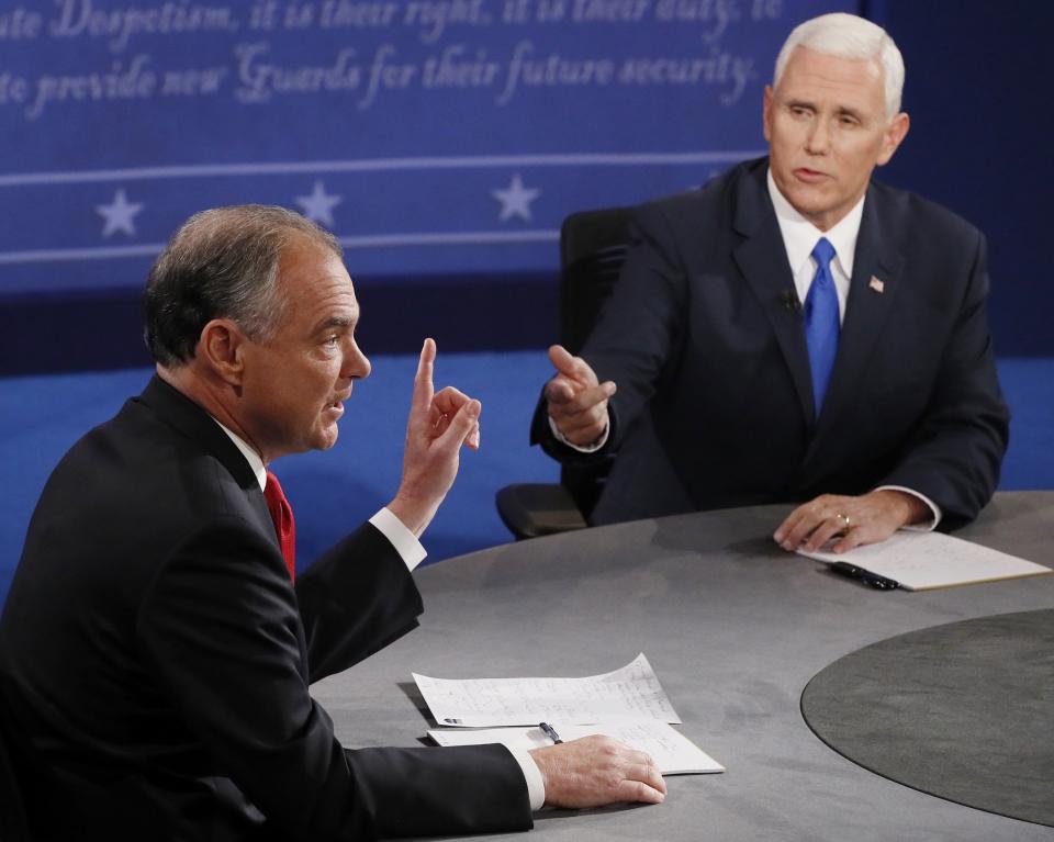 Republican vice-presidential nominee Gov. Mike Pence, right, and Democratic vice-presidential nominee Sen. Tim Kaine speak during the vice-presidential debate at Longwood University in Farmville, Va., Tuesday, Oct. 4, 2016. (Photo: Andrew Gombert/Pool via AP)