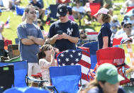 Fans wait for the start of the National Baseball Hall of Fame induction ceremony at the Clark Sports Center on Sunday, July 21, 2019, in Cooperstown, N.Y. (AP Photo/Hans Pennink)