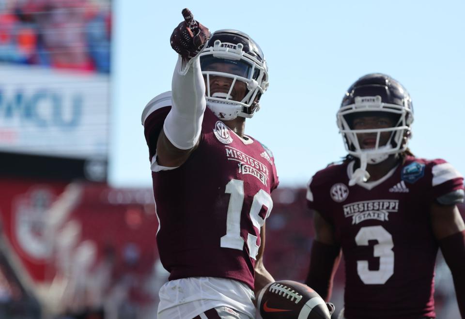 Jan 2, 2023; Tampa, FL, USA;Mississippi State Bulldogs safety Collin Duncan (19) celebrates with cornerback Decamerion Richardson (3) against the Illinois Fighting Illini during the second half in the 2023 ReliaQuest Bowl at Raymond James Stadium. Mandatory Credit: Kim Klement-USA TODAY Sports