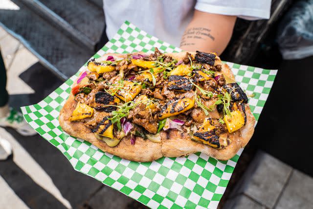 Sabrina Sellers Jerk Lions Mane Mushroom Artisan Pizza with grilled pineapple, red onions, avocado, and sautéed kale and Swiss chard.
