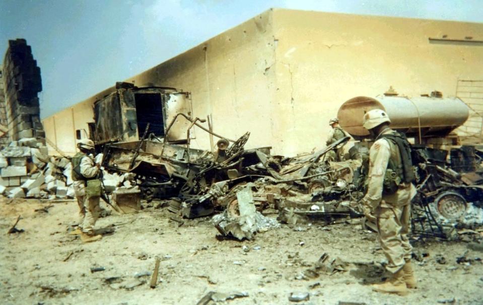 Soldiers from 2nd Brigade, 3rd Infantry Division inspect wreckage from an Iraqi ballistic missile strike on the brigade operations center that occurred on April 7, 2003. (Capt. William Glaser/Army)
