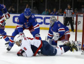 New York Rangers' Jacob Trouba (8) stands over Washington Capitals' Alex Ovechkin (8) as Rangers goalie Igor Shesterkin guards the net during the first period of an NHL hockey game Thursday, Feb. 24, 2022, in New York. (AP Photo/John Munson)