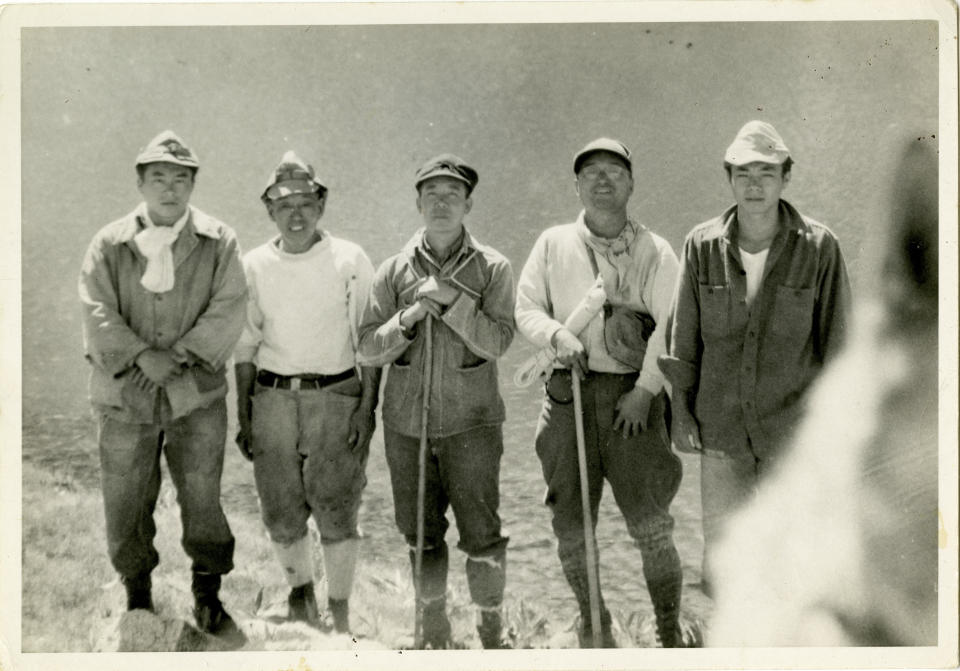 This 1945 photo provided by the Matsumura family via the National Park Service shows the burial party for Giichi Matsumura after he died on Mount Williamson during his incarceration at an internment camp for people of Japanese ancestry in Manzanar, Calif., during World War II. A skeleton found by hikers this fall near California's second-highest peak was identified Friday, Jan. 3, 2020, as Matsumura, a Japanese American artist who had left the Manzanar internment camp to paint in the mountains in the waning days of World War II. (Matsumura Family/National Park Service via AP)