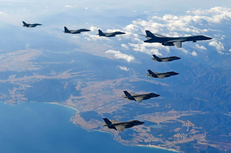 <p>U.S. Air Force B-1B bomber (L), South Korea and U.S. fighter jets fly over the Korean Peninsula during the Vigilant air combat exercise (ACE) on December 6, 2017 in Korean Peninsula, South Korea. The largest-scale warplanes and military personnel take part in the annual joint exercise, which was scheduled before the North’s latest missile test. North Korea fired a new intercontinental ballistic missile (ICBM) on November 29, believed to have shown capability to reach to the U.S. mainland. (Photo by South Korean Defence Ministry via Getty Images) </p>