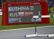 2016 Rio Olympics - Athletics - Preliminary - Women's Long Jump Qualifying Round - Groups - Olympic Stadium - Rio de Janeiro, Brazil - 16/08/2016. An electronic score board shows the score for Darya Klishina (RUS) of Russia. REUTERS/Kai Pfaffenbach