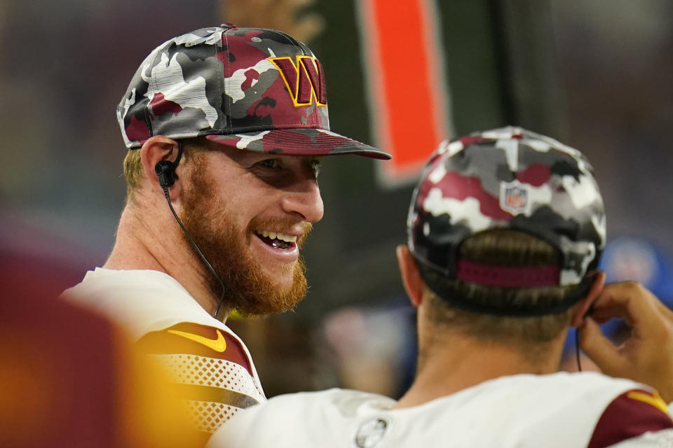 Washington Commanders quarterback Carson Wentz stands on the sideline in the second half of a preseason NFL football game against the Baltimore Ravens, Saturday, Aug. 27, 2022, in Baltimore. (AP Photo/Julio Cortez)