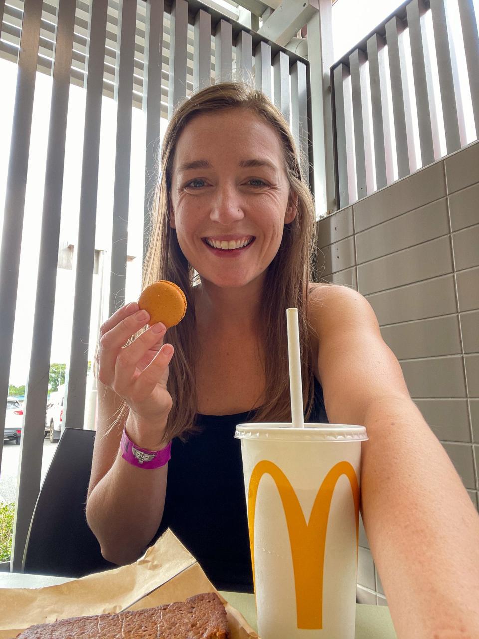 The author takes a bite of a macaron at a McDonald's in Innisfail, Australia.