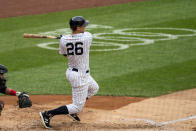 New York Yankees' DJ LeMahieu (26) hits a single during the third inning of a baseball game against the Miami Marlins at Yankee Stadium, Saturday, Sept. 26, 2020, in New York. (AP Photo/Corey Sipkin)