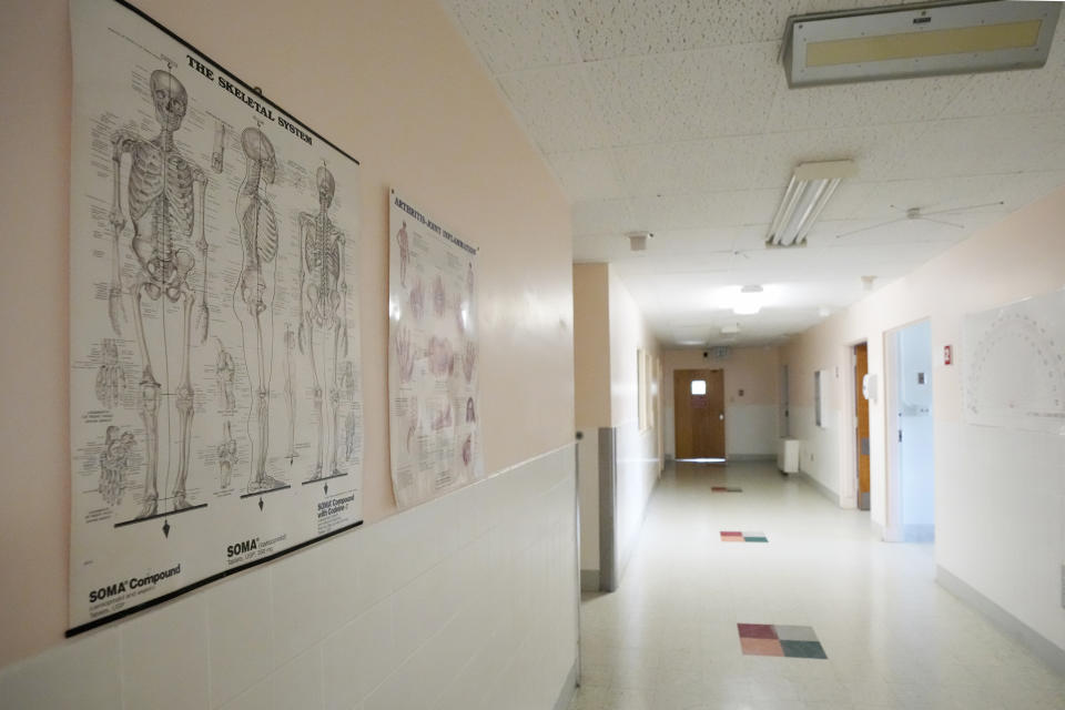 Medical diagrams line the hallway of one of the wings of the Alliance Healthcare System hospital in the Holly Springs, Miss., as photographed Feb. 29, 2024. The medical facility was initially approved by the federal government as a rural emergency hospital in March, 2023, requiring closing all inpatient beds and providing 24/7 emergency care. However, they have been denied that status and must now transition back to a full-service hospital. (AP Photo/Rogelio V. Solis)