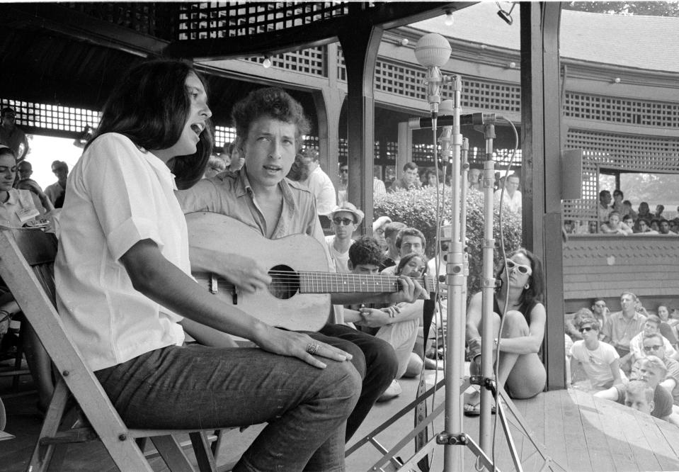 Portrait of folk musicians Joan Baez and Bob Dylan taken while they shared the stage during a duet at the Newport Folk Festival, Rhode Island, 1963. This was Bob Dylan's first performance on the Newport stage. 