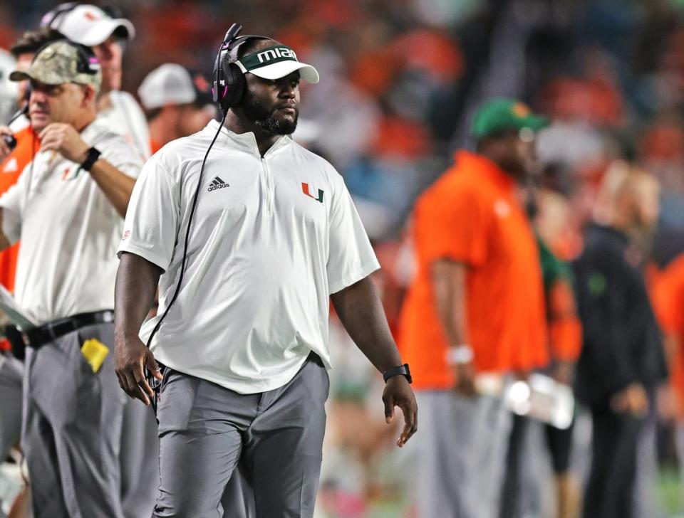 Miami Hurricanes running backs coach Eric Hickson looks from the sidelines during the first quarter of their ACC football game against the Virginia Cavaliers at Hard Rock Stadium on Thursday, September 30, 2021 in Miami Gardens, Florida.