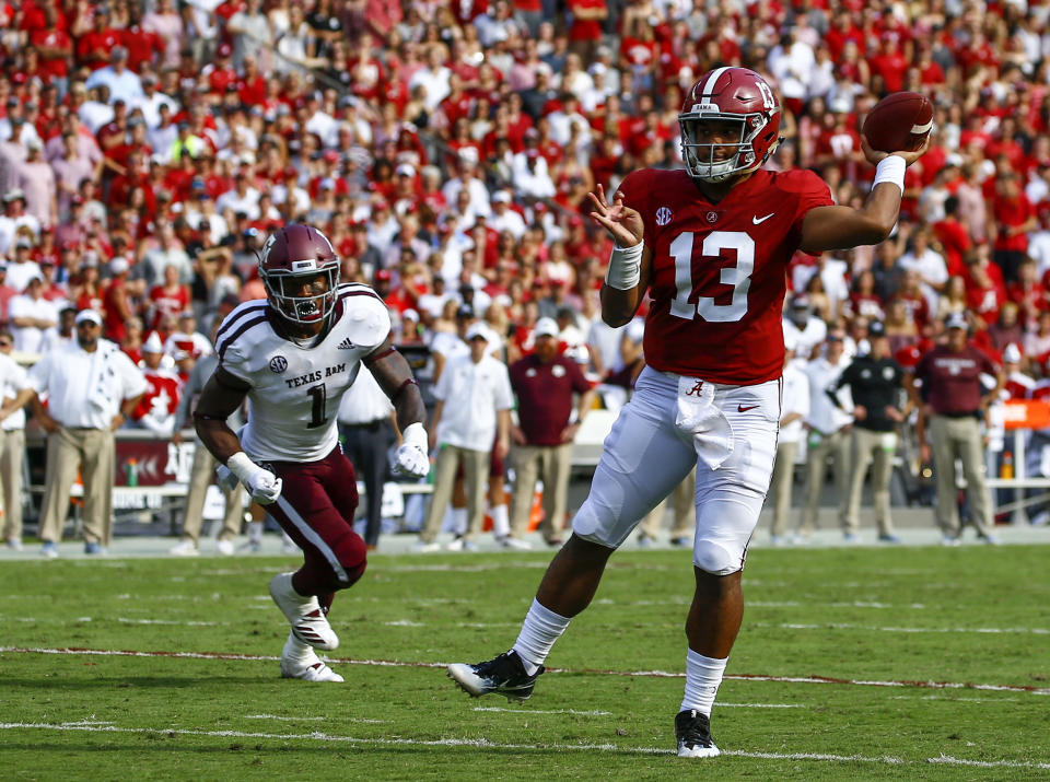 Alabama quarterback Tua Tagovailoa (13) throws a touchdown pass against Texas A&M during the first half of an NCAA college football game, Saturday, Sept. 22, 2018, in Tuscaloosa, Ala. (AP Photo/Butch Dill)
