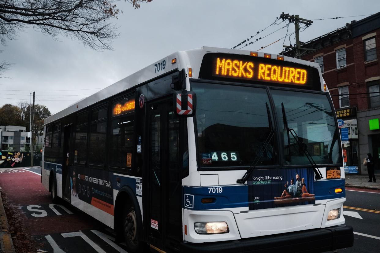 A bus displays a message noting masks are required to board on Nov. 12, 2020 in the Staten Island borough of New York City. Staten Island's seven-day positive test rate for COVID-19 is the highest in the city.