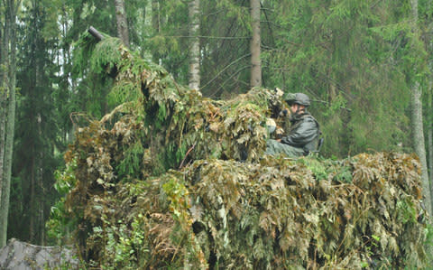 A Belarus' soldier aims his anti-aircraft gun at a training ground at an undisclosed location in Belarus.  - Credit: Vayar Military Agency/AP