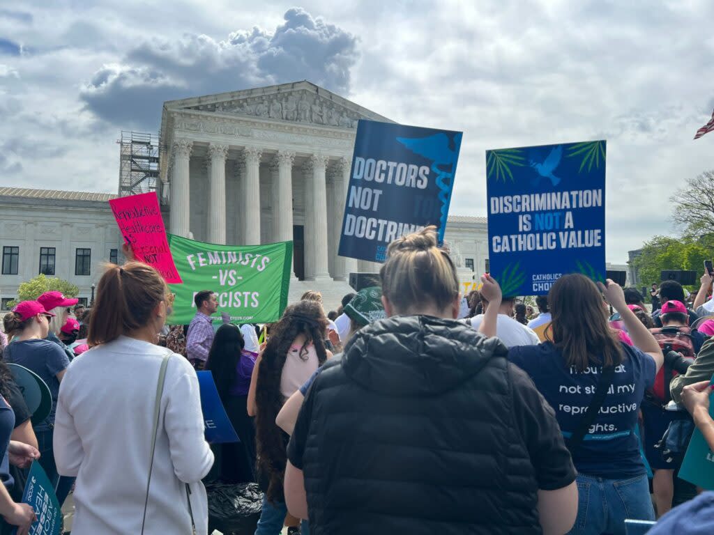 Protesters gather outside the U.S. Supreme Court on Wednesday, April 24, 2024, while justices hear oral arguments about whether federal law protects emergency abortion care.