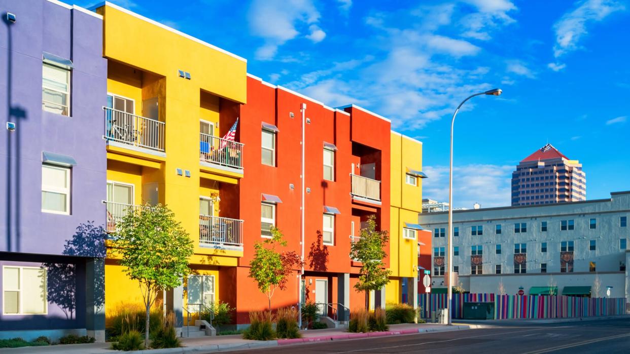 Photo of a city street with new, colorful townhouses in downtown Albuquerque, New Mexico, USA.